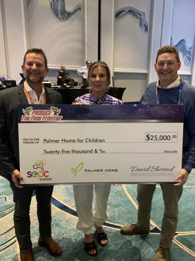 SEPC presenting Palmer Home for Children CEO Drake Bassett with a $25,000 donation